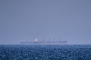 A bulk carrier ship anchored in the Strait of Hormuz, Saturday, 18 April 2026
